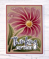 Handmade greeting card with flower on it and thinking of you sentiment on it.