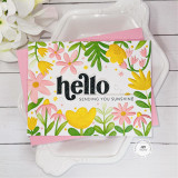 Handmade greeting card with flowers on it and hello, sending you sunshine sentiment on it.