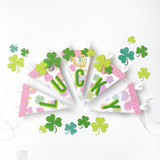 Handmade paper-crafted garland of pennants with an Irish theme, featuring letters that spell out the sentiment “Lucky.”