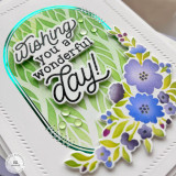 Handmade greeting card with floral oval on it and wishing you a wonderful day sentiment on it.