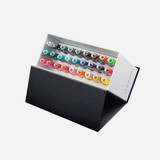 Karin Brushmarker PRO Set featuring 26 vibrant colors plus a clear blending brush, all arranged in a side view.