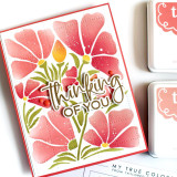 Handmade greeting card with flowers on it and thinking of you sentiment on it.