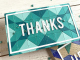 Handmade greeting card with colorful triangles and thanks sentiment on it.