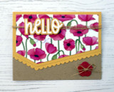 Handmade greeting card with flowers on it and a hello sentiment with a button on it.