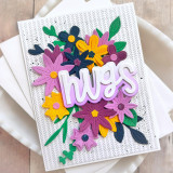 Handmade greeting card with flowers on it and hugs sentiment on it. Handmade greeting card with flowers on it and hugs sentiment on it.