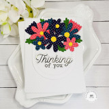 Handmade greeting card with flowers on it and thinking of you sentiment on it.