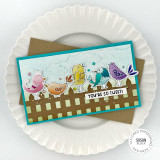 Handmade greeting card with doodle birds on fence with you're so tweet sentiment on a plate in background.