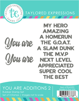 You Are Additions 2 sentiment rubber stamp set featuring 11 rubber stamps with phrases like you are, my hero, amazing, a homerun, the GOAT, a slam dunk, the MVP, next level, appreciated, super cool, and the best.