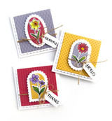 Three small handmade tags with grateful, hello, and thanks sentiment on it with flowers.
