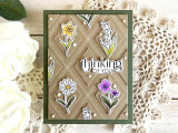 Handmade greeting card with think of you sentiment with flowers and a rug in the background.