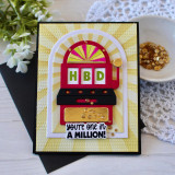 Handmade greeting card with a slot machine on it with you're one in a million sentiment on it with flowers in background.