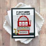Handmade greeting card of a slot machine with jackpot sentiment on it and if you're lucky, there's money inside sentiment on it with cardstock in background.