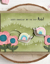 Handmade greeting card with flowers and snails on it with just snailin' by to say hi sentiment on it.