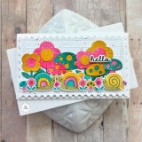 Handmade greeting card with mushrooms, flowers, and snails with hello sentiment with cardstock in the background.