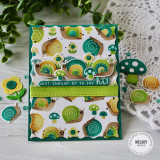 Handmade greeting card with snails and mushrooms on it with just snailin' by to say hi sentiment with snails, flowers, and mushrooms in the background.
