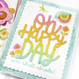 Handmade greeting card with mushrooms, flowers, and snails with oh happy day let's shell-ebrate sentiment on it with flowers in background.