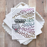 Handmade greeting card of colorful rainbow heart rays and a cat with delivering loads of love sentiment on it.