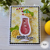 Handmade greeting card with a drink cup, citrus fruit, and cheers to you sentiment on it with flowers in the background.