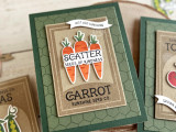 Handmade greeting card with three carrots on it and scatter seeds of kindness sentiment on it with cards in the background.