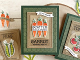 Handmade greeting card with carrots on it and scatter seeds of kindness sentiment on it with crafting materials in the background.