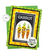 Handmade greeting card with three carrots on it and loves grows here sentiment on it with cardstock in the background.