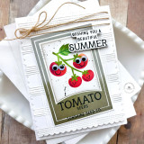 Handmade greeting card with tomatoes on it with wishing you a beautiful summer sentiment on it with cardstock in background.