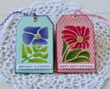 Two handmade greeting tags with flowers on it and one with birthday blessings sentiment and the other with happy happy birthday sentiment on it. Two handmade greeting tags with flowers on it and one with birthday blessings sentiment and the other with happy happy birthday sentiment on it.