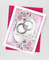 Handmade greeting card with oval frame and flowers with congrats sentiment.