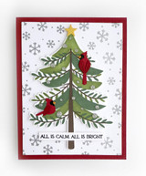 Handmade greeting card with tree on it with ornaments and two cardinals on it and all is calm, all is bright sentiment on it.