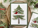 Handmade greeting card with tree on it with with ornaments and cardinal on it with all is calm, all is bright sentiment on it.