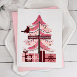 Handmade greeting card with tree on it with ornaments and a cardinal with presents underneath and season's greetings sentiment on it.