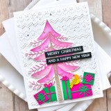 Handmade greeting card with tree on it and presents under it with a bird and merry christmas and happy new year senitment on it.