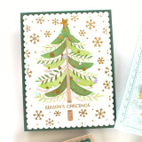 Handmade greeting card with tree on it with ornaments and season's greetings sentiment on it.