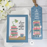 Handmade greeting card with books on it, a lamp, and mug with a sentiment on it and a matching bookmark next to it with books on it.