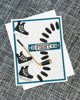Handmade greeting card with hockey skates on it, pucks, and a hockey stick with go fight sentiment on it