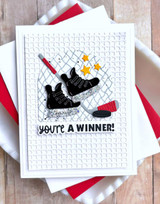 Handmade greeting card with hockey ice skates on it and you're a winner sentiment on it.