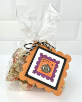 Handmade gift tag with a spider on a postage stamp on it with a spider on it.