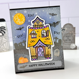 Handmade greeting card with haunted house on it and eek! sentiment and happy halloween sentiment on it.
