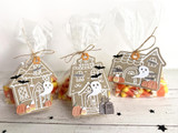 Three handmade greeting tags that are three different haunted houses with ghosts and pumpkins on them.
