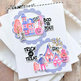 Handmade greeting card with haunted house on it, monsters, and pumpkins with various halloween sentiments on it.