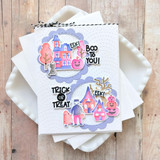 Handmade greeting card with haunted house on it, monsters, and pumpkins with various halloween sentiments on it.