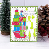 Handmade greeting card with sled with presents on it and season's greeting sentiment on it.