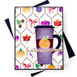 Handmade greeting card of pumpkins, leaves, and bows inside geometric patterns with a coffee cup on it and autumn blessings sentiment on it.