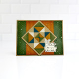 Handmade greeting card with quilt square on it and sew glad we're friends sentiment on it.