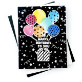 Handmade greeting card with balloons holding a present up with happy birthday to you sentiment on it. Handmade greeting card with balloons holding a present up with happy birthday to you sentiment on it.