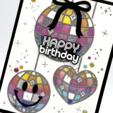 Handmade greeting card with disco balls on it with a bow on one of them with happy birthday sentiment on it. Handmade greeting card with disco balls on it with a bow on one of them with happy birthday sentiment on it.