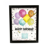 Handmade greeting card with balloons holding up a present on it with happy birthday sentiment on it. Handmade greeting card with balloons holding up a present on it with happy birthday sentiment on it.