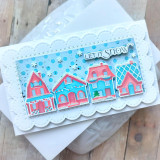 Handmade greeting card with houses on it with snowflakes with let it snow sentiment on it.