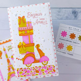 Handmade greeting card with a scooter with presents on it with bonjour and mon amour sentiments on it.