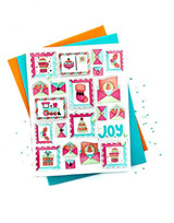 Handmade greeting card of Christmas postage with joy sentiment on it.